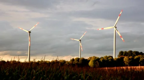 Green renewable energy concept - wind generator turbines in sky Stock Footage 46189922