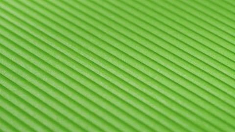 Green ribbed paper close-up. Macro shooting of cardboard textured background Vídeo Stock 169237361