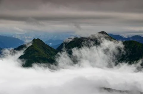 Green ridges in clouds, Carnic Alps Friuli Venezia Giulia Italy Stock Photos