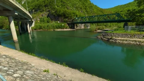 Green river flows under bridges and hills. Ovcar Kalbar Gorge, Serbia Видео 333843624