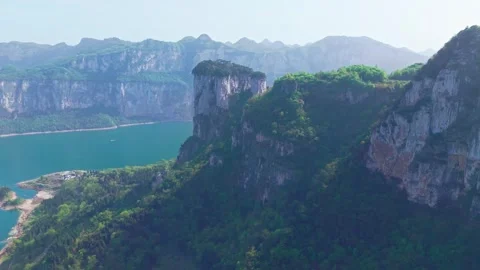 A green river flows under the high cliffs Stock Footage 311537661