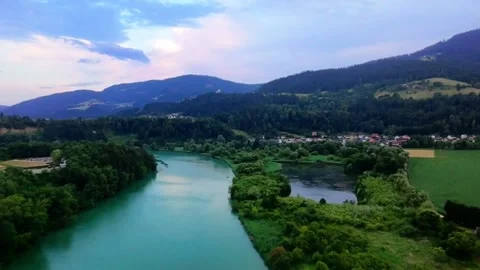 Green river next to lake with forest aerial Stock Footage 311879679