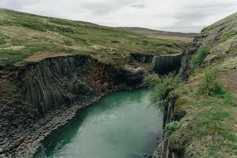 The Green River Through Studlagil basalt canyon, Iceland Stock Photos