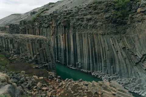 The Green River Through Studlagil basalt canyon, Iceland Stock Photos
