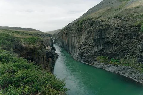 The Green River Through Studlagil basalt canyon, Iceland Stock Photos