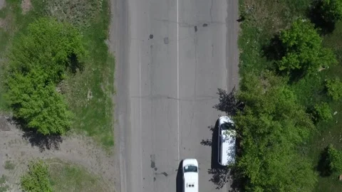 Green road with a car passing by 1 Video stock 335526106