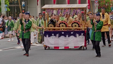 Green-Robed Escorts Flank Drum Float with Wisteria Decoration Video stock 341415279
