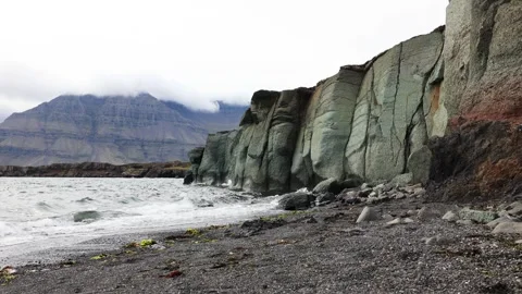Green rock at the coast Stock Footage 251737856