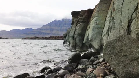 Green rock at the coast Stock Footage 251737865