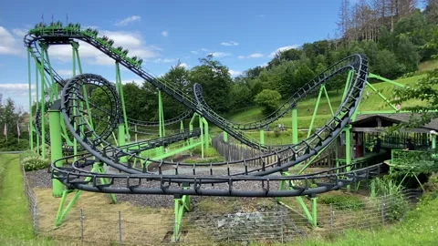 Green roller coaster in an amusement park Stock-Footage 170785970