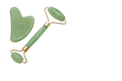 Green Roller Face Guasha Scraper and Neck Scraper isolated on white backgroun Stock Photos