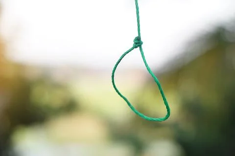 Green rope hanging loop. Concept,  tying rope knots in daily life. String for fa Stock Photos