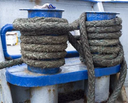 Green rope on ship bit Stock Photos