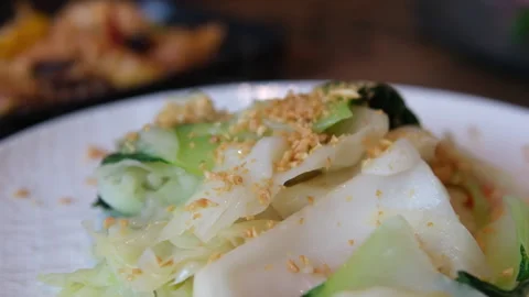 Green salad Chinese cabbage sprinkled with nuts Asia Stock Footage 316834839