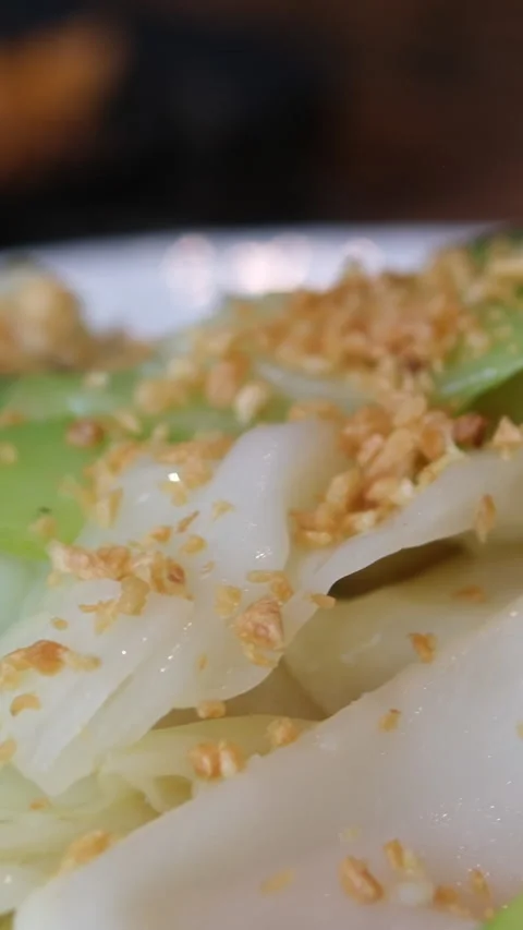 Green salad Chinese cabbage sprinkled with nuts Asia Stock Footage 316895100