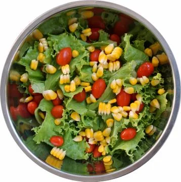 Green salad with tiny tomato inside the bowl Stock Photos