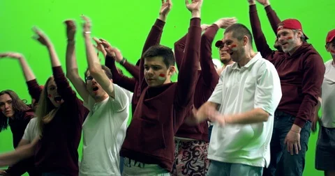 GREEN SCREEN  3/4 view group of fans doing a wave during a sport event Stock Footage 110520431