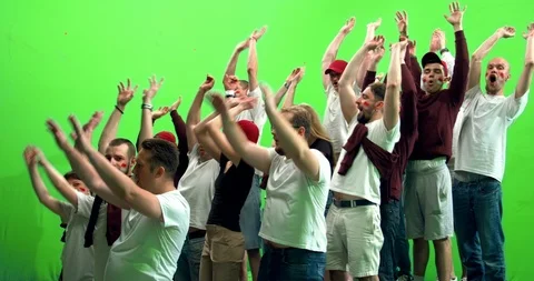 GREEN SCREEN  3/4 view group of fans doing a wave during a sport event Stock Footage 110620031