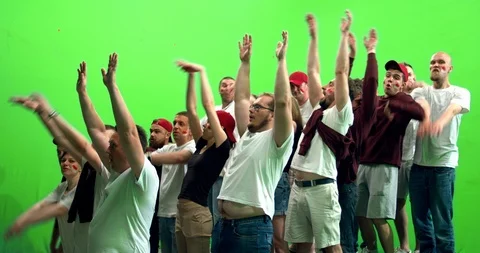 GREEN SCREEN  3/4 view group of fans doing a wave during a sport event Stock Footage 110620184