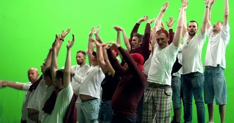 GREEN SCREEN  3/4 view group of fans doing a wave during a sport event Stock Footage 110621042