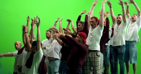 GREEN SCREEN  3/4 view group of fans doing a wave during a sport event Stock Footage 110621370