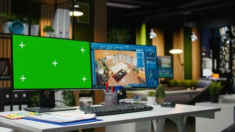 Green screen and architectural software on dual monitors at the workstation Stock Photos