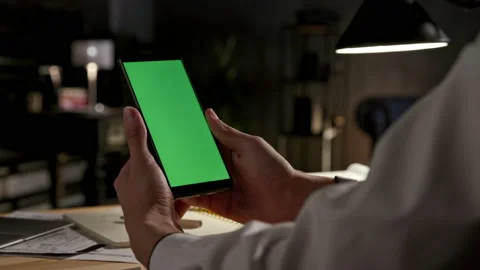 Green Screen and Chroma Key of Smartphone. Businessman Holding Smart Phone in Ha Video stock 199481085