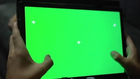 Green screen and Chroma Key of tablet computer. man holding a mobile computer Video stock 257220354