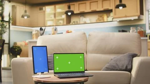 Green screen and vertical blue screen in home interior with coffee table Stock Photos