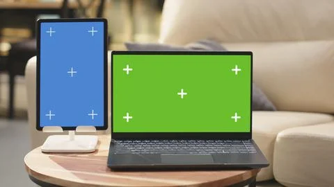 Green screen and vertical blue screen in home interior with coffee table Stock Photos