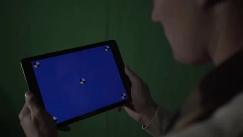 Green Screen Background Man holds Tablet with Blue Screen Stock Footage
