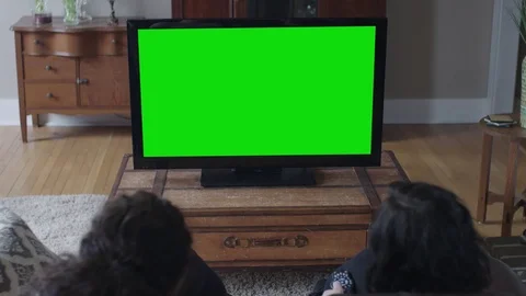 Green screen big screen with two young ladies in the foreground Stock Footage 71146877