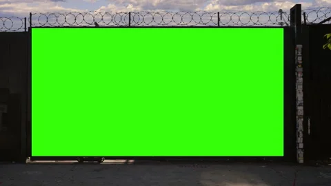 Green Screen Billboard Behind Barbed Wire Fence Mockup Stock Footage 342219847