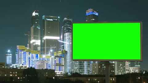 Green screen billboard on a megapolis with neon lights, skyscrapers on Stock-Footage 142201749