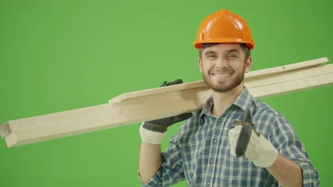 Green screen. Builder in a Hard Hat, Uses a Construction Tool Stock Footage 224762363