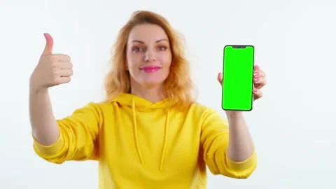 Green screen in camera focus, advertising, chroma key, Yes gesture and woman wit Stock Footage 257539211