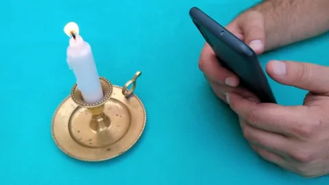 Green screen, candle and the man texting on his phone Vídeos de archivo 342845520