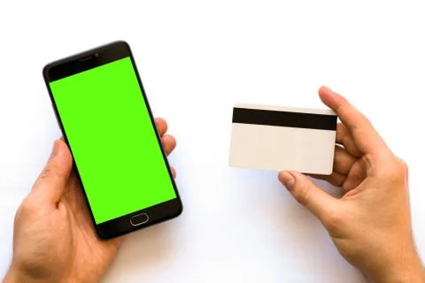 Green screen for chroma key compositing Smartphone with Online payments plast 库存照片