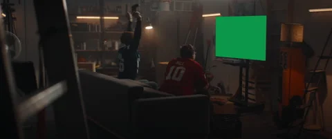 GREEN SCREEN CHROMA KEY Friends playing console games, winning and celebrating Stock Footage 145657686