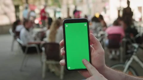Green Screen chroma key Handheld Smartphone phone with Barcelona city view Stock Footage 255317490