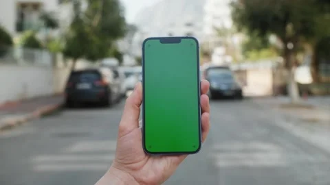 Green Screen chroma key Handheld Smartphone. Travel with phone concept Stock Footage 256165213