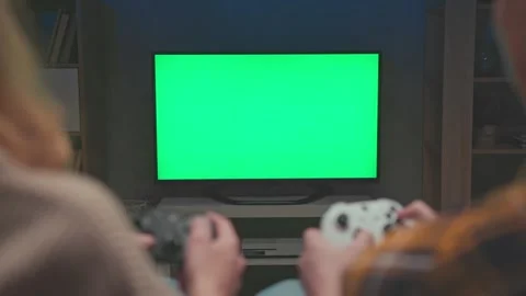 Green Screen for Chroma Key of People Playing Video Game on Console Controllers Stock Footage 320670337