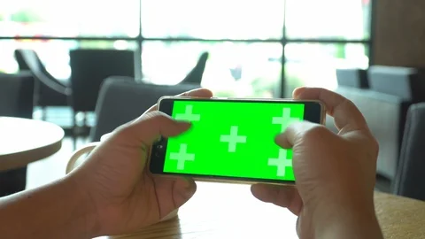 Green screen chroma key on tablet,women working or using tablet in coffee shop. Stock Footage 96290542