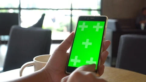 Green screen chroma key on tablet,women working or using tablet in coffee shop. Stock Footage 96291650