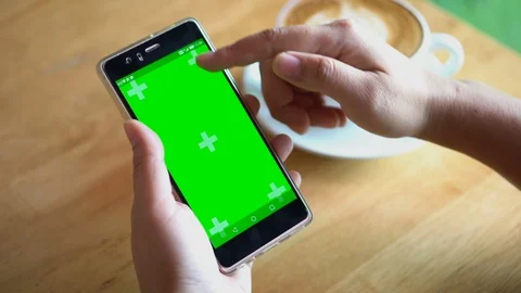 Green screen chroma key on tablet,women working or using tablet in coffee shop. Stock Footage 96378227