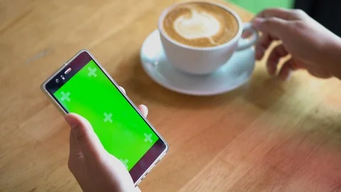 Green screen chroma key on tablet,women working or using tablet in coffee shop. Stock Footage 96380900