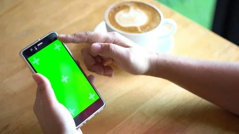 Green screen chroma key on tablet,women working or using tablet in coffee shop. Stock Footage 96381610