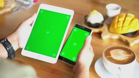 Green screen chroma key on tablet,women working or using tablet in coffee shop. Stock Footage 96383877