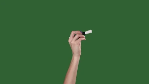 Green screen. Chromakey. Female hand writes a marker on the wall. Stock Footage 106139727