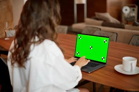 Green screen, chromakey of laptop computer with tracking markers. Business woman Stock Photos